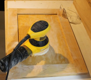 Sanding the cabinet doors