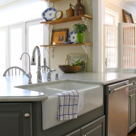 Rustic kitchen shelves over peninsula